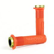 two orange mushroom waffle mountain  bike grips and green lockrings on a white background