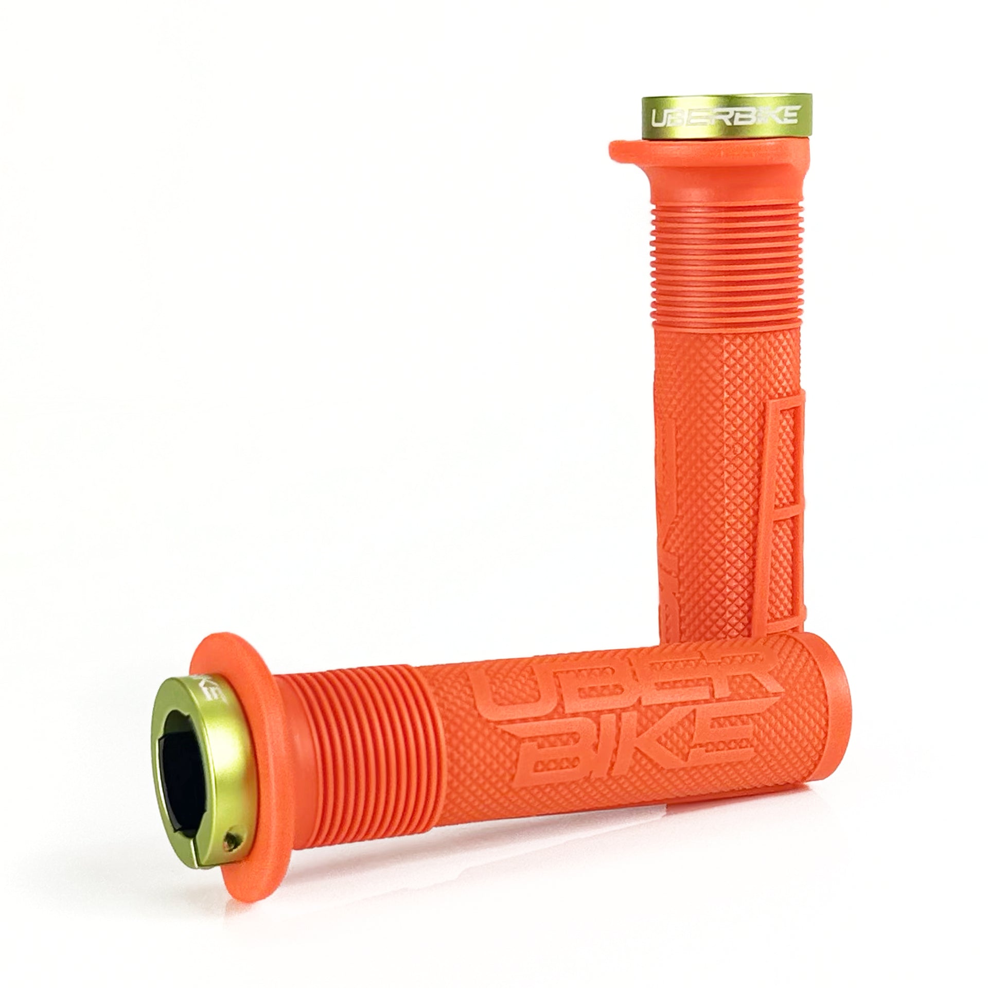 two orange mushroom waffle mountain  bike grips and green lockrings on a white background