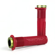 two red mushroom waffle mountain  bike grips and green lockrings on a white background