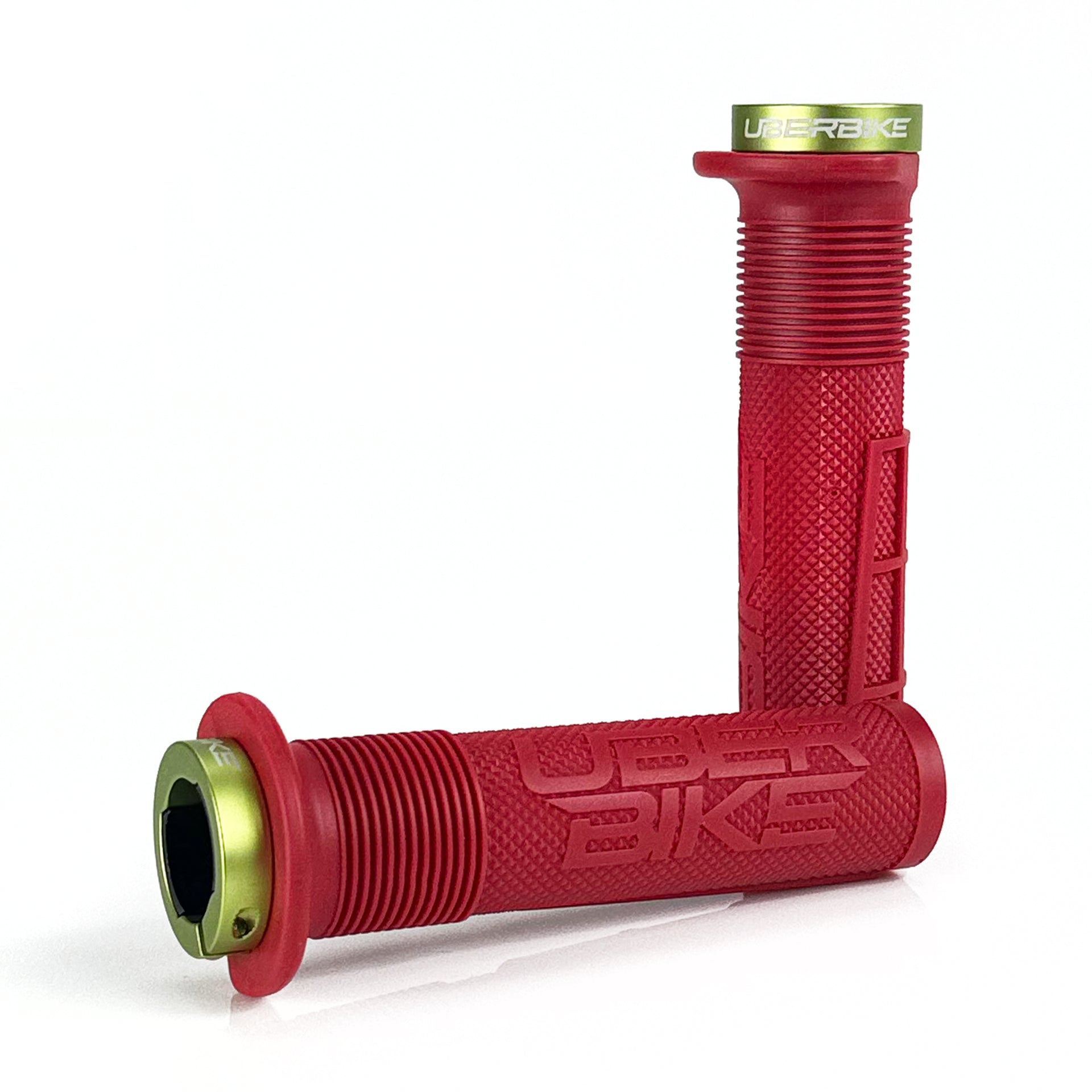 two red mushroom waffle mountain  bike grips and green lockrings on a white background