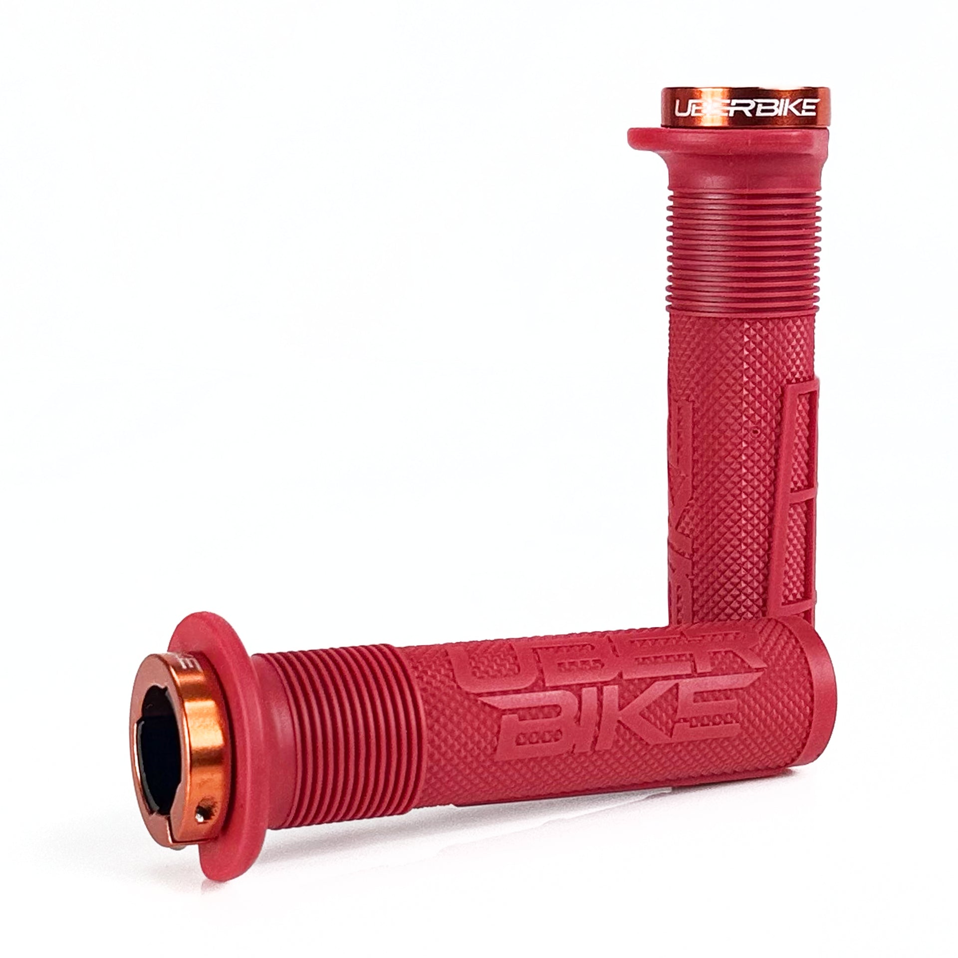 two red mushroom waffle mountain  bike grips and orange lockrings on a white background