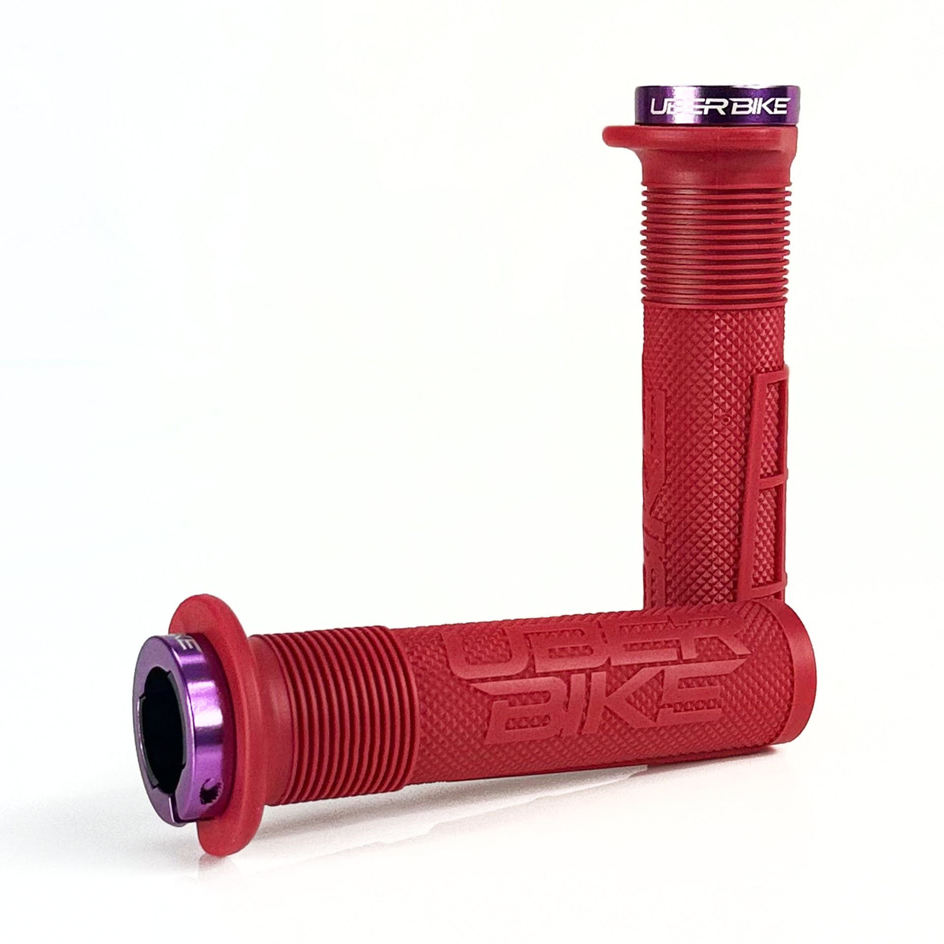 two red mushroom waffle mountain  bike grips and purple lockrings on a white background