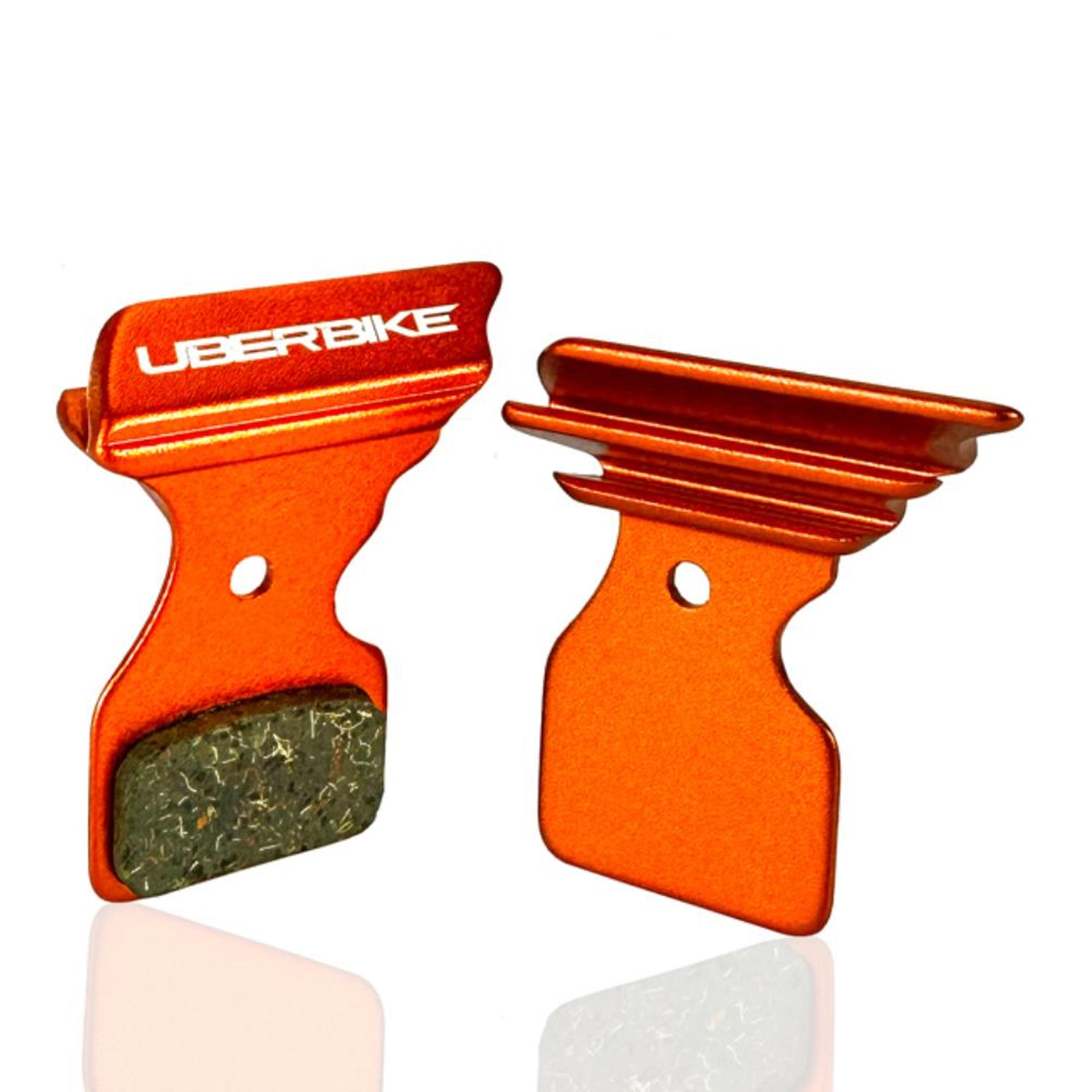 Orange Shimano Polar Tech brake pads on a white background