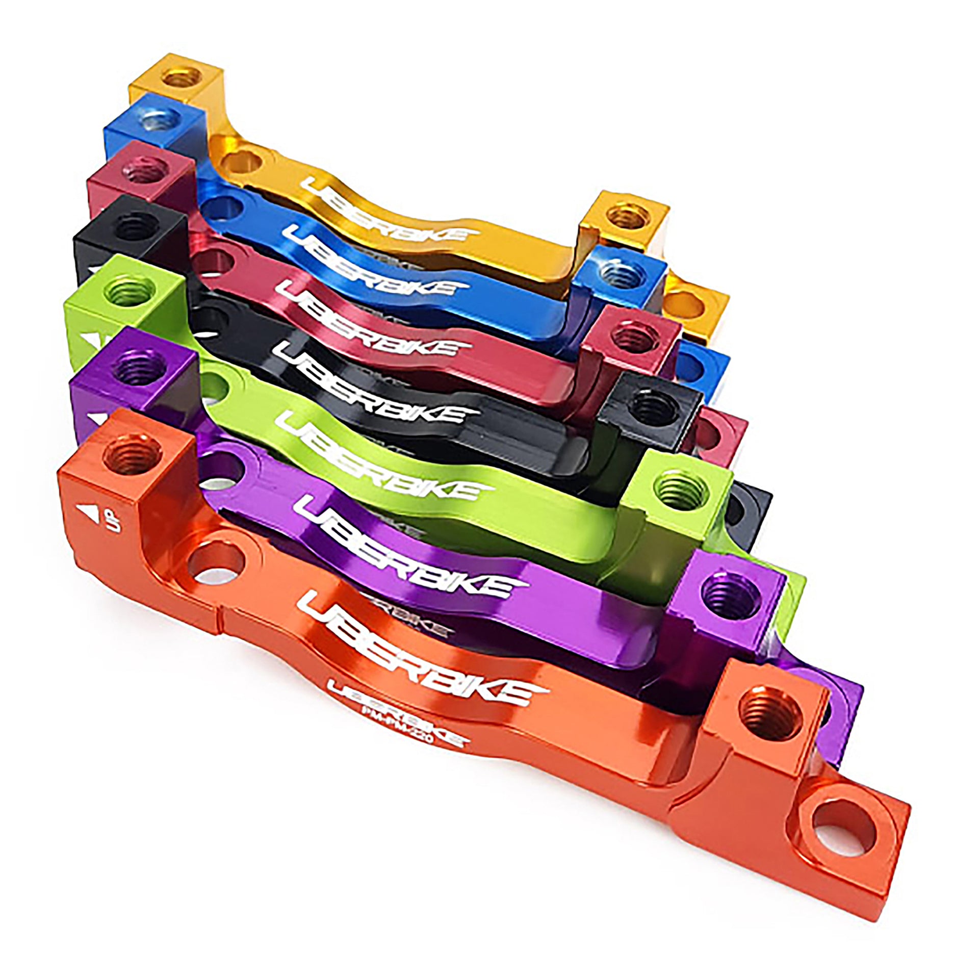 7 different coloured post mount adapters for 180mm to 220mm rotors with Uberbike branding on a white background 
