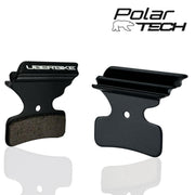 Black brake pads with Uberbike branding on a white background, featuring the Polar Tech logo.