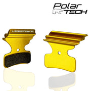 Gold colour  Uberbike brake pads  on a white background, featuring the Polar Tech logo.