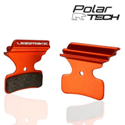Orange Uberbike brake pads on a white background, featuring the Polar Tech logo.