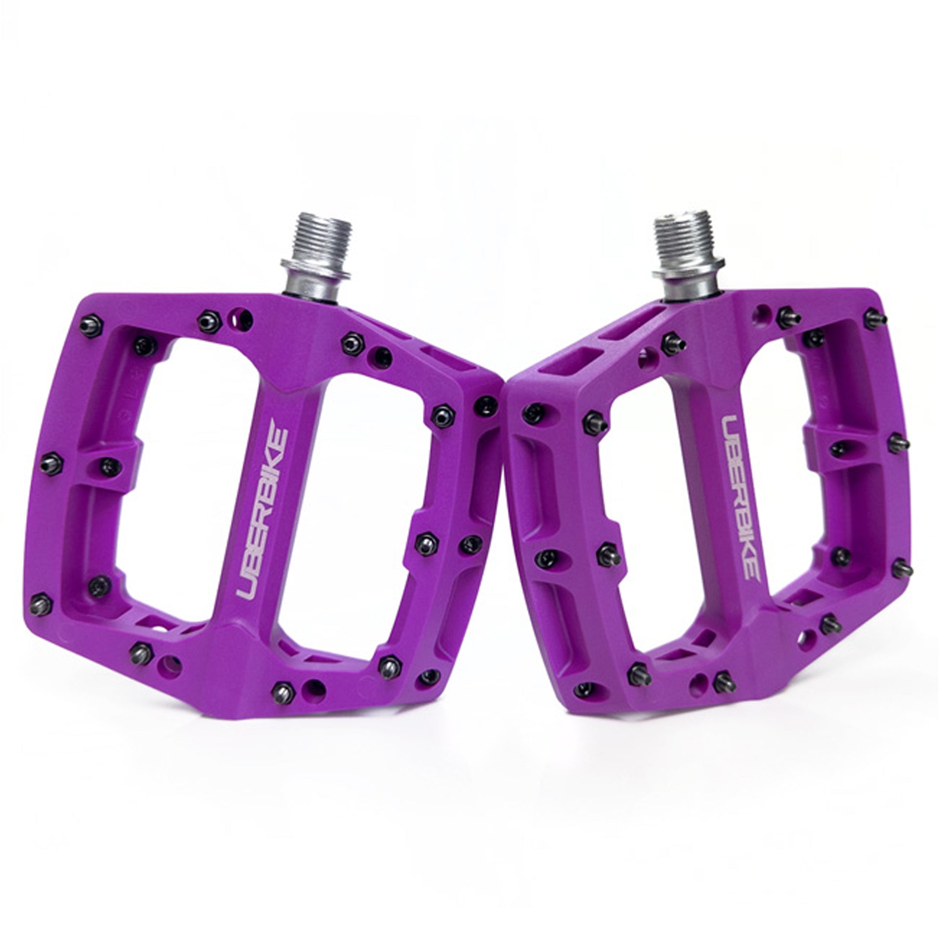A pair of purple apex composite pedals on a white background