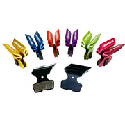 7 different coloured finned sram code bronze stealth disc brake pads on a white background