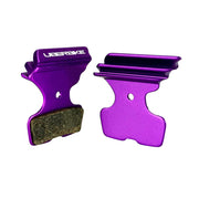 purple finned sram code silver stealth disc brake pads on a white background