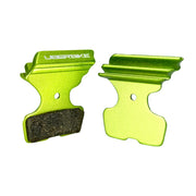 green finned sram DB8 disc brake pads on a white background