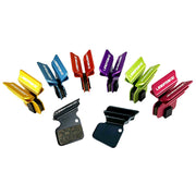 various coloured finned SRAM Force CX1 brake pads on a white background