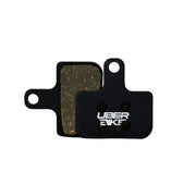 SRAM Force ETAP AXS semi metallic  brake pads with Uberbike branding on a white background