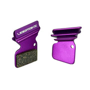 purple finned SRAM Force Rival 22 brake pads on a white background