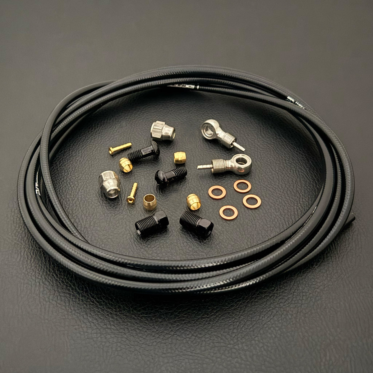 SRAM G2 RSC black kevlar hydraulic brake hose kit with silver banjo fittings and Uberbike branding on a black background