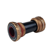 Bronze SRAM GXP bottom bracket with ceramic end caps and bearings on a white background