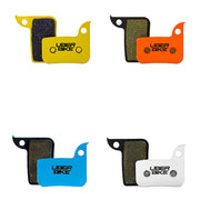 4 different sram level tlm 2016-2020 monoblock caliper brake pads with uberbike branding on a white background