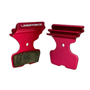 red finned sram motive silver disc brake pads on a white background