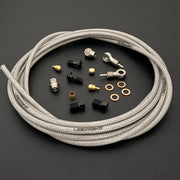 SRAM XX hydraulic raw silver stainless  brake hose kit with silver banjo fittings and Uberbike branding on a black background
