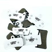 Uberbike brake pads on a white background.