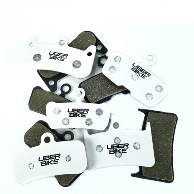 Uberbike brake pads on a white background.