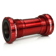 Red Shimano DUB bicycle bottom bracket on a white background