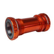 Shimano DUB orange bottom bracket on a white background, with Uberbike logos