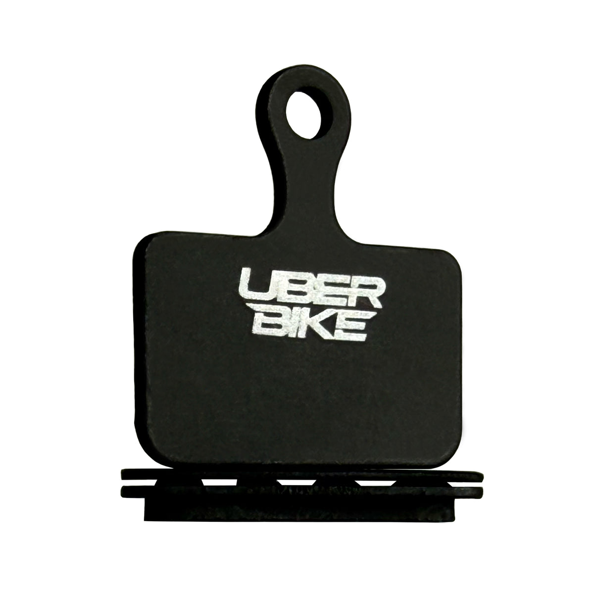 Shimano GRX Limited RX820-LE disc brake pads with vented hollow back plate with Uberbike branding on a white background