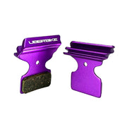 purple finned Shimano M985 brake pads on a white background