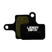 Black Shimano MT805 brake pads with Uberbike branding on a white background