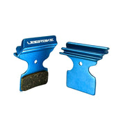 blue finned Shimano SLX M675 disc brake pads on a white background
