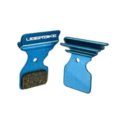 blue finned Shimano SLX M7100 disc brake pads on a white background