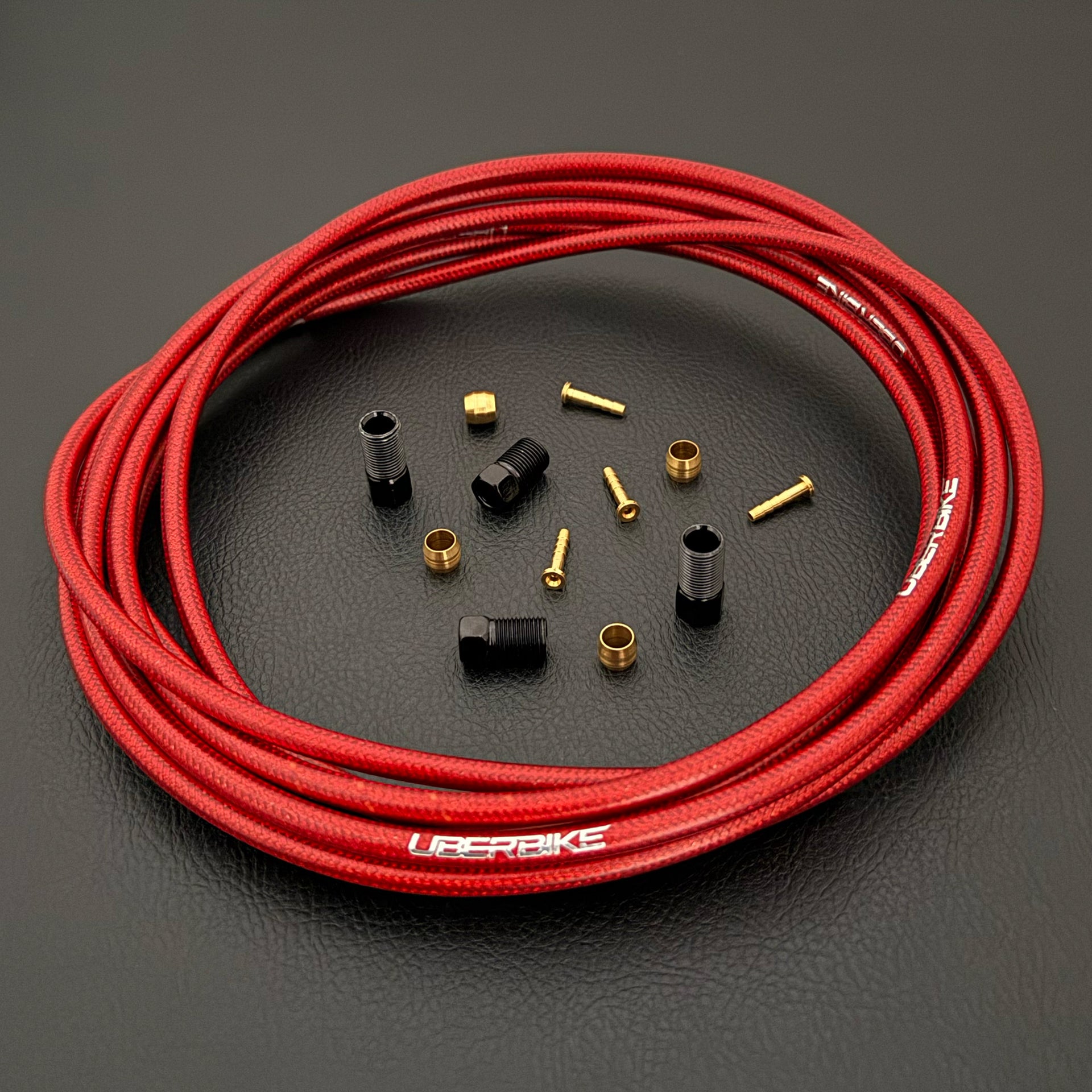 Shimano xtr hydraulic red braid kevlar brake hose kit with straight connector fittings and Uberbike branding on a white background