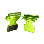 green finned Shimano Trail M9100 brake pads on a white background