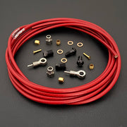 Shimano XTR red braid kevlar hydraulic brake hose kit with banjo fittings and Uberbike branding on a black background