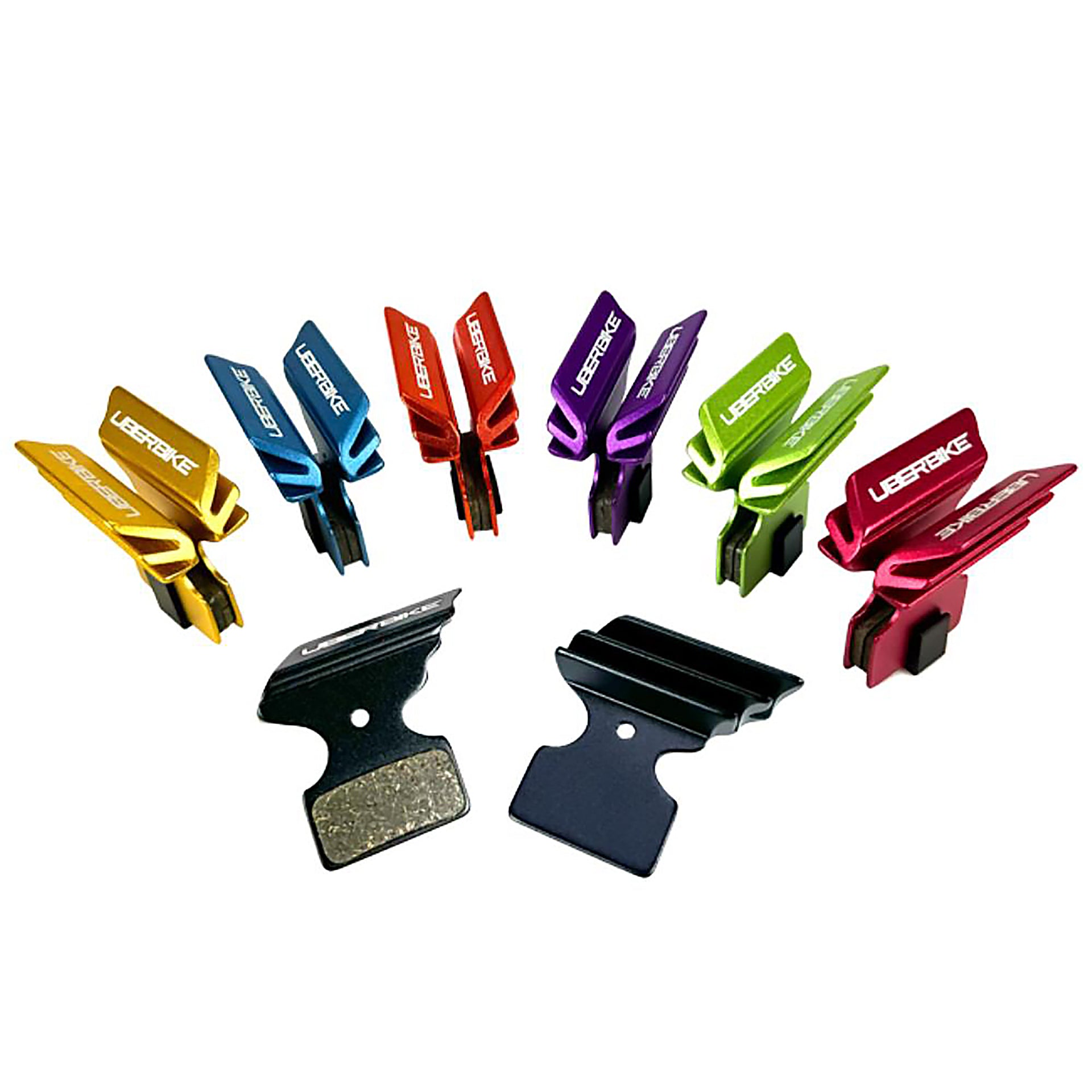 various coloured finned Shimano XTR M9020 brake pads on a white background