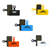5 different coloured brake pads for Shimano m6200 calipers with Uberbike branding on a white background