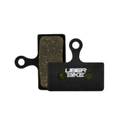 Shimano m6200 semi metallic compound Uberbike branded brake pads on a white background 