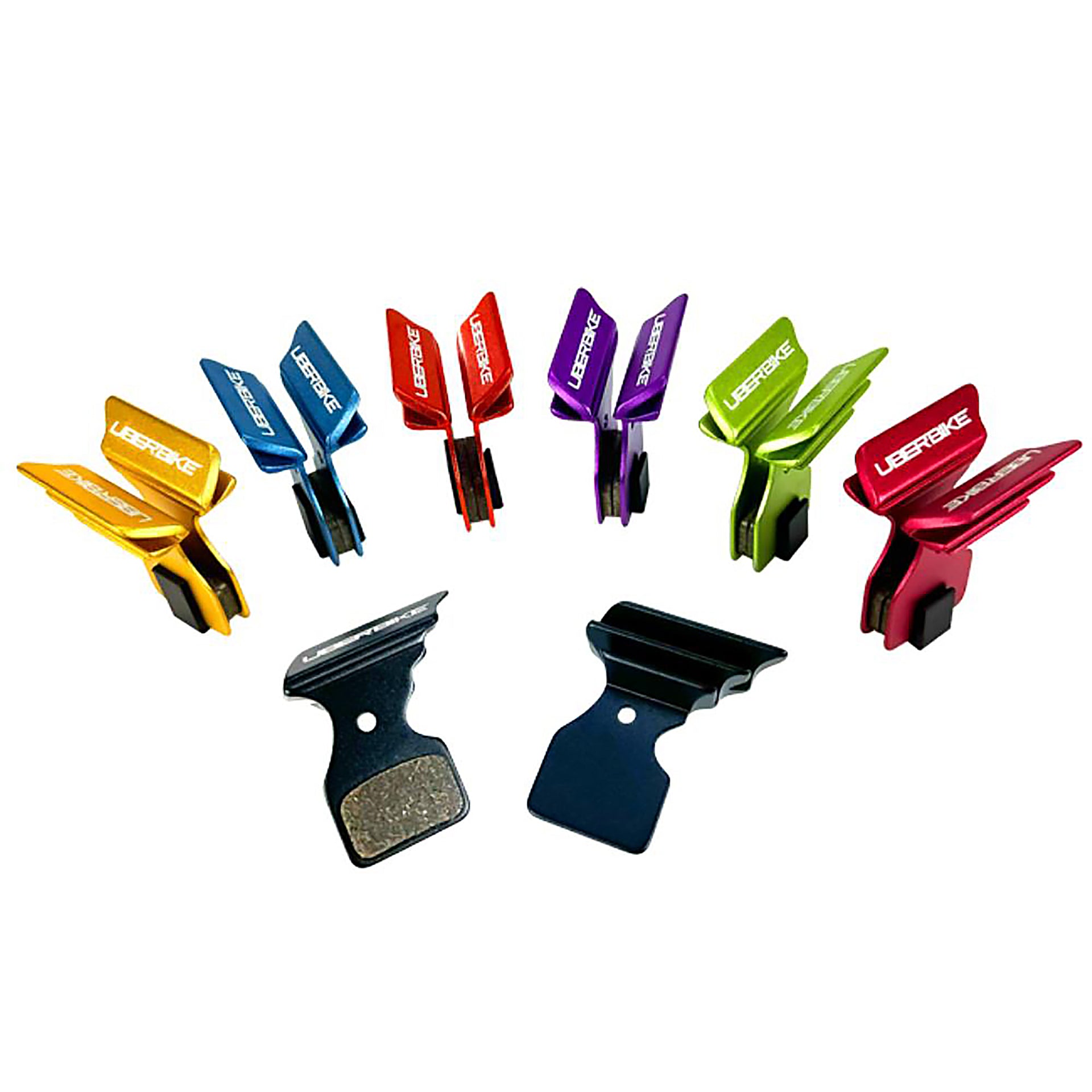 7 different coloured Shimano Polar Tech pads with Uberbike branding on a white background