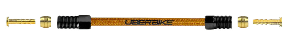 An exploded diagram of Shimano XTR gold braid kevlar hydraulic brake hose kit with straight connector fittings with Uberbike branding on a white background