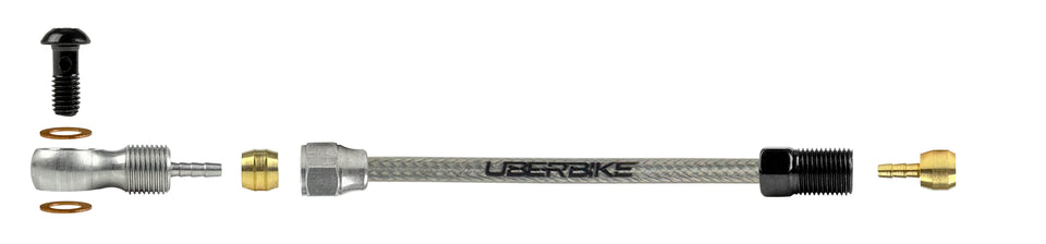 An exploded diagram of a stainless hydraulic brake hose kit for Shimano XTR brakes with Uberbike branding and banjo fittings on a white background