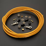 Shimano xtr hydraulic gold braid  kevlar brake hose kit with banjo fittings and Uberbike branding on a white background