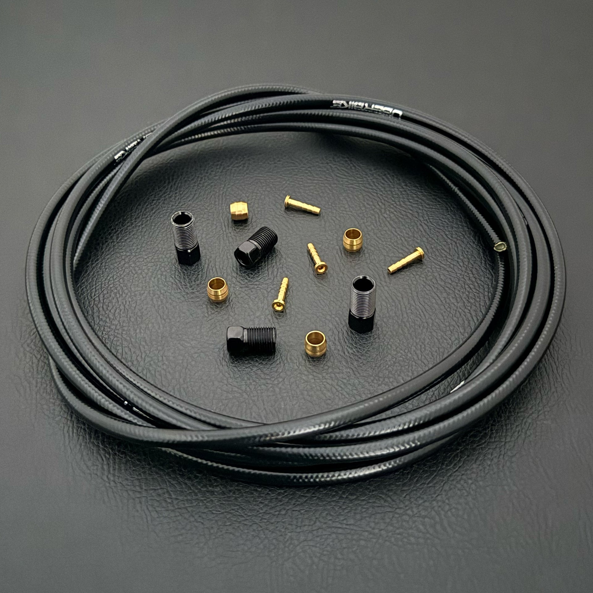 Shimano xtr hydraulic black kevlar brake hose kit with straight connector fittings and Uberbike branding on a white background