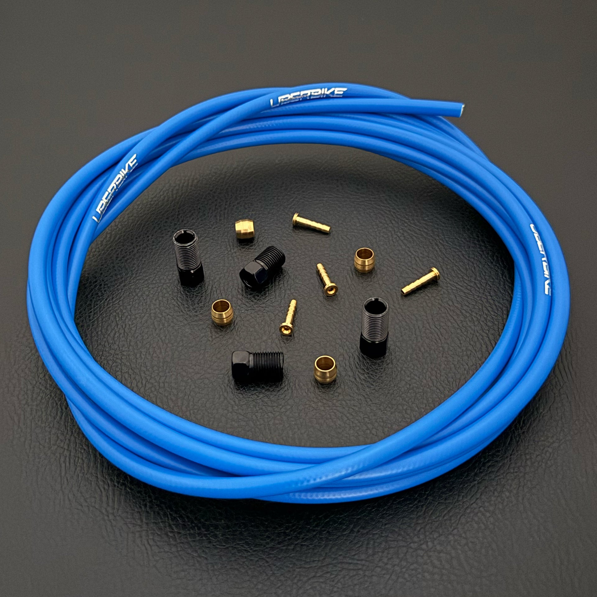 Shimano xtr hydraulic blue kevlar brake hose kit with straight connector fittings and Uberbike branding on a white background