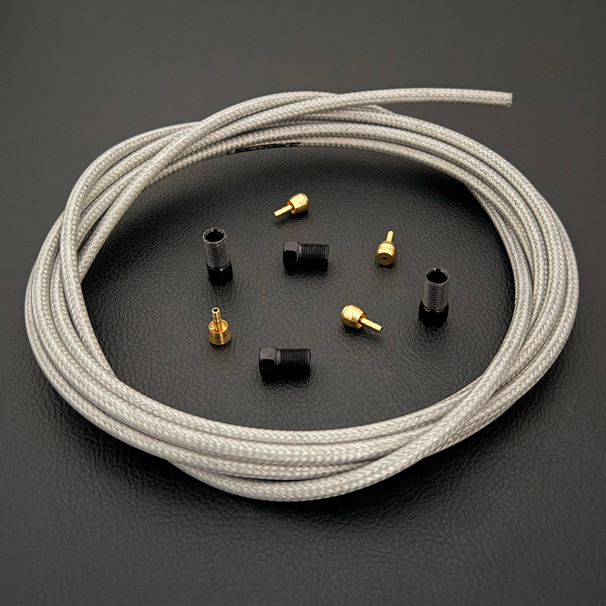 Shimano xtr hydraulic silver braid stainless brake hose kit with straight connector fittings and Uberbike branding on a white background