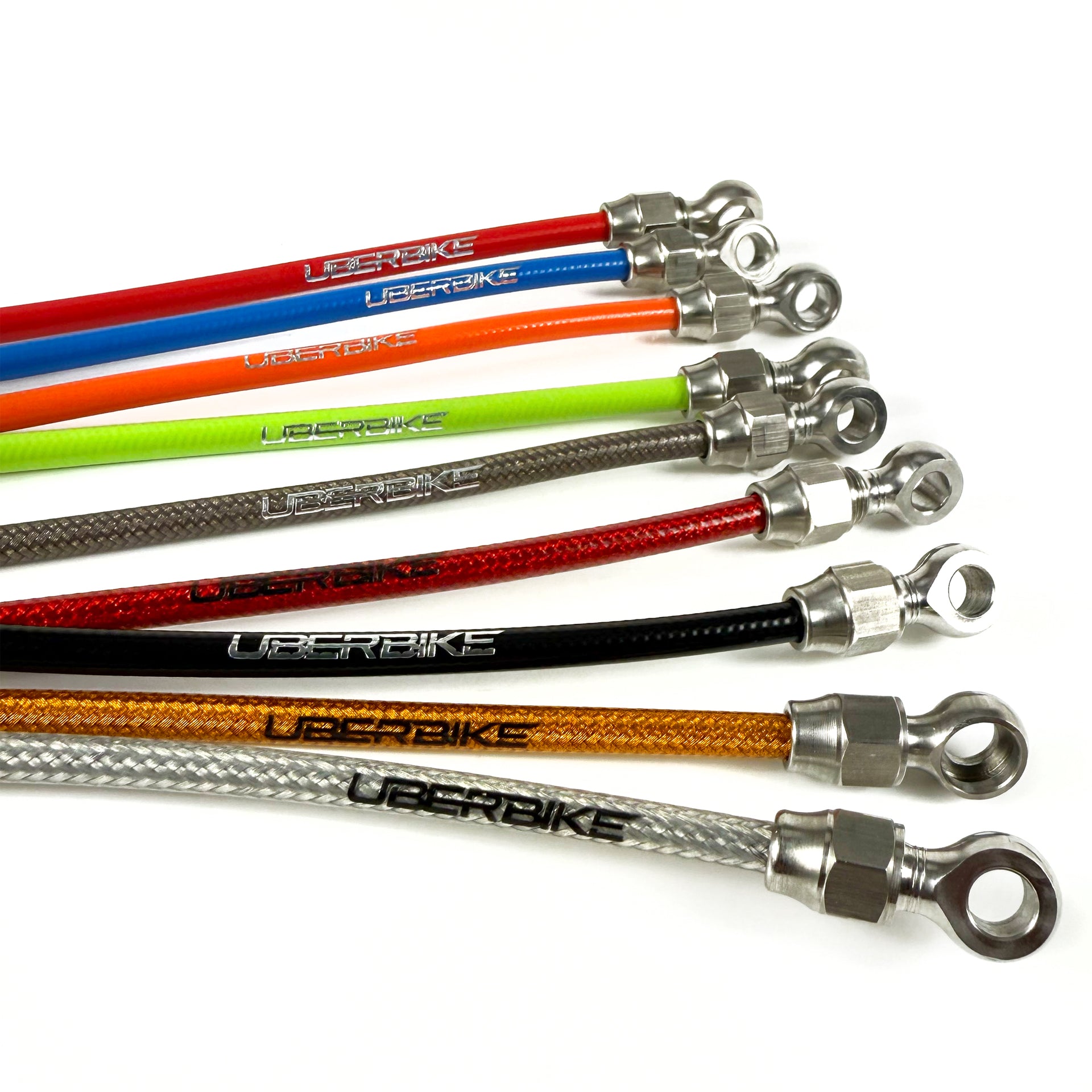 Seven bicycle brake cables in different colours, all featuring the 'UBERBIKE' brand logo, arranged diagonally on a white background