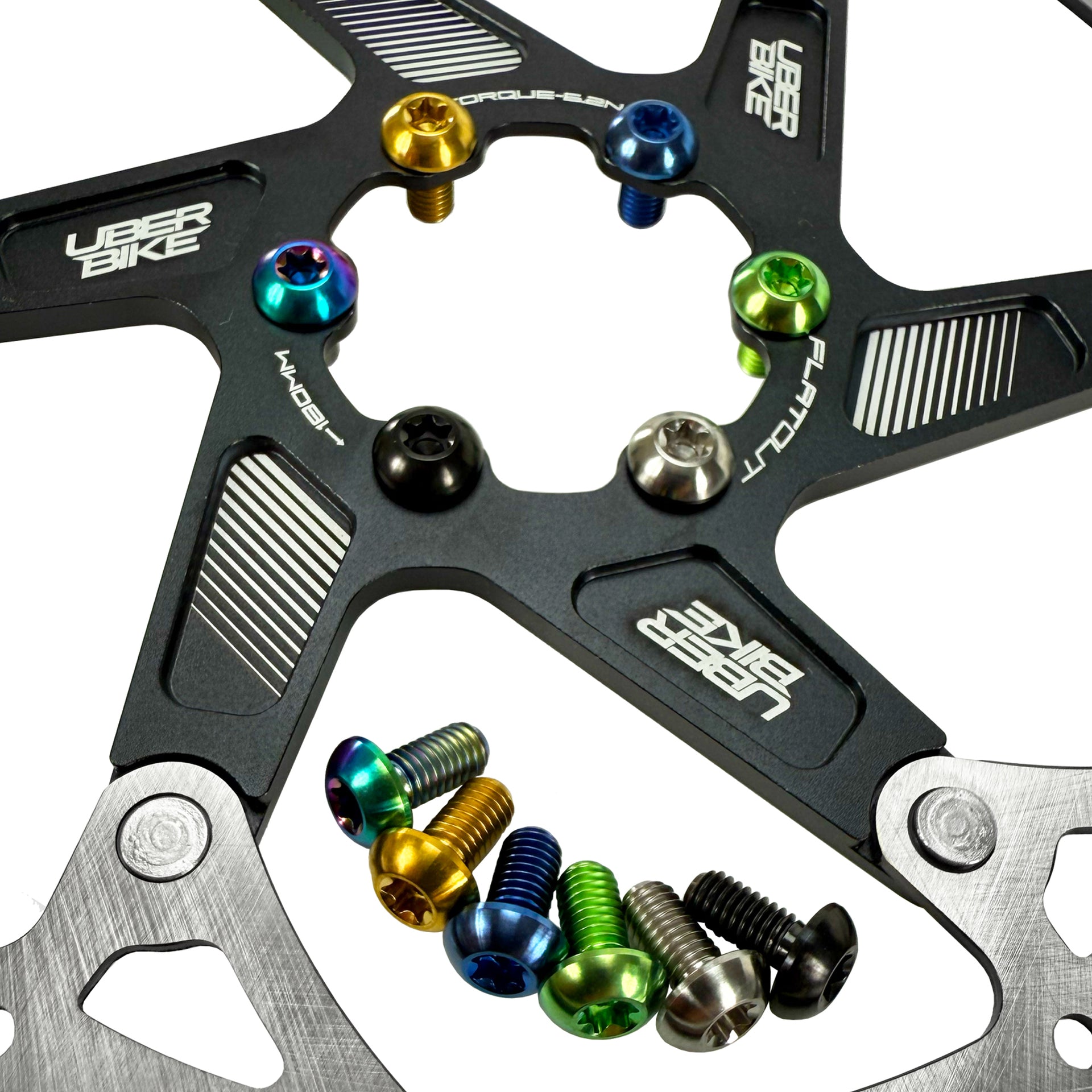 Close-up of a bike disc brake rotor with colourful titanium rotor bolts on a white background