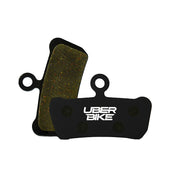 TrickStuff Direttissima 2022+ semi metallic brake pads with Uberbike branding on a white background