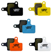 Collection of Uberbike brake pads in various colors on a white background.