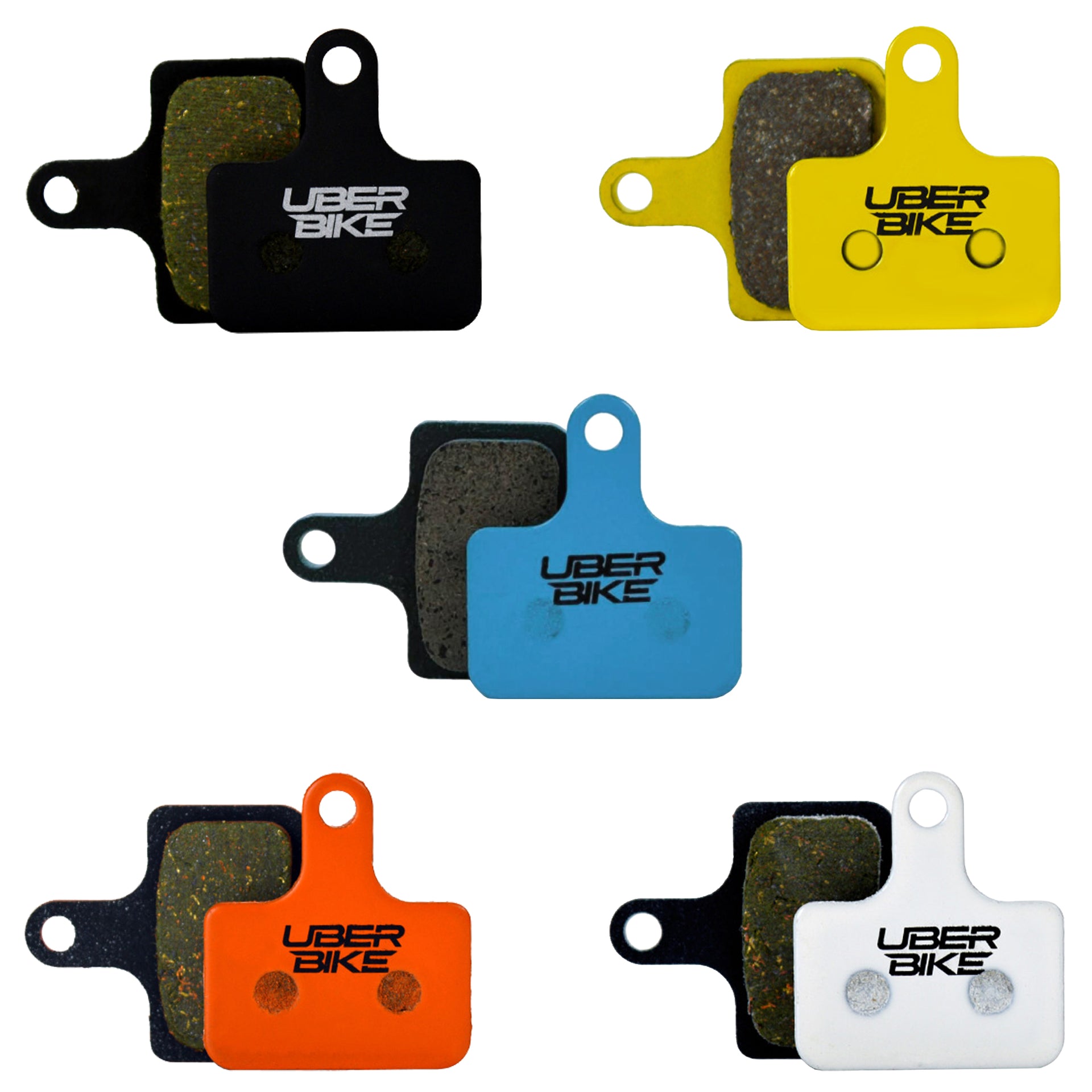 Collection of Uberbike brake pads in various colors on a white background.